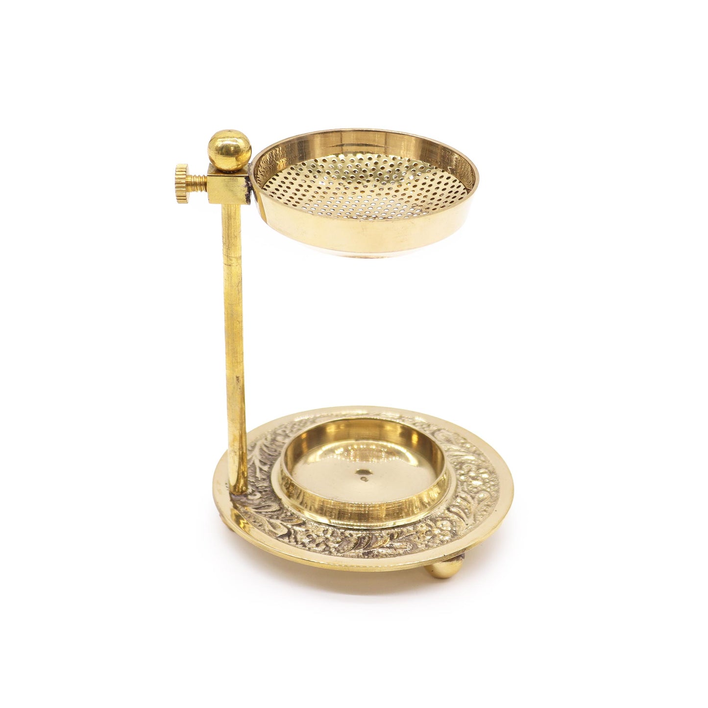 A brass incense burner, sits on a stand, against a white background.