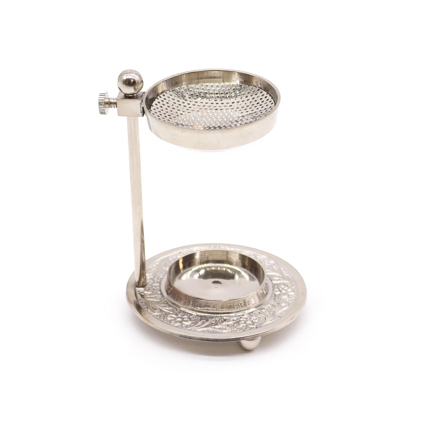 A metallic incense burner, stands upright, on a white background. The burner has a perforated top bowl and an intricately decorated base.