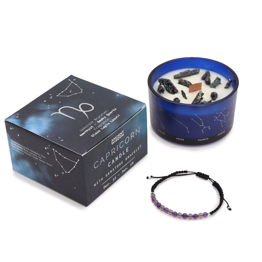 A blue candle, adorned with gemstones, sits near a Capricorn-themed box. Text includes "Capricorn Candle with Gemstone Bracelet," and dates "Dec. 22 - Jan. 19." A beaded bracelet is nearby.