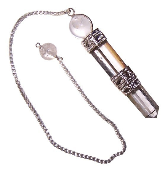 A crystal pendulum dangles on a silver chain. The chain has a small clear orb partway along its length. The pendulum itself is a clear crystal, capped by decorative silver.