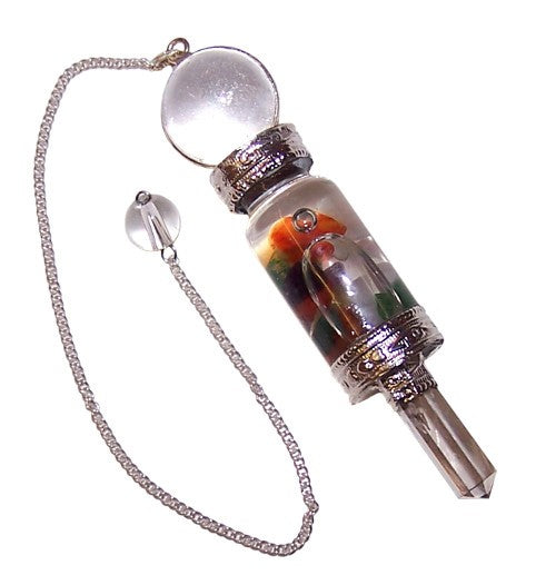 A pendulum dangles on a silver chain. A clear, crystal-filled cylinder with decorative metal caps leads to a crystal point, all against a white background.