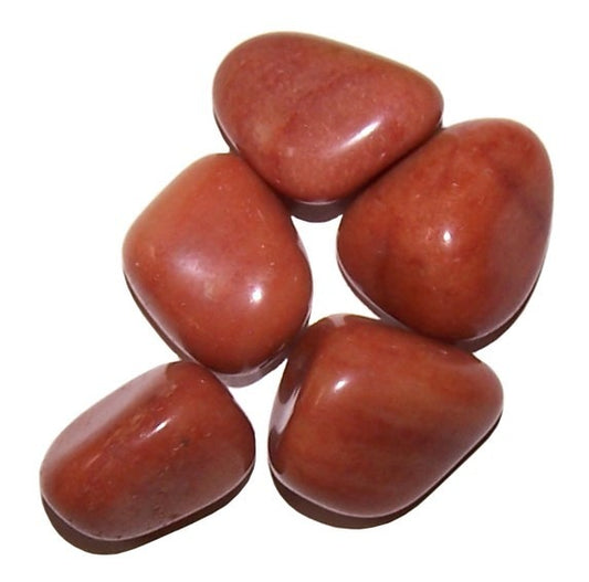 Five polished, reddish-brown stones are grouped together on a white surface.
