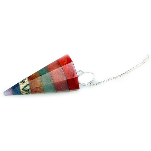 A cone-shaped, segmented pendulum in chakra colors hangs by a silver chain, on a bright white background.