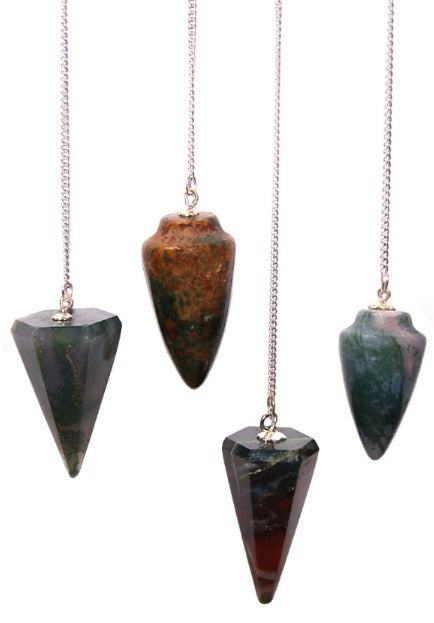Four pendulums with stones as the bob dangle from silver chains, against a white backdrop. The stones are cone-shaped and varied in color, with shades of green, brown, and red.