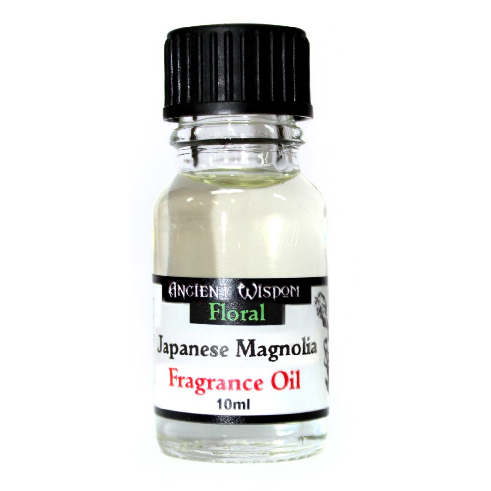 A small, clear glass bottle containing a light-colored liquid sits against a white background. The bottle is capped with black and labeled: ANCIENT WISDOM Floral Japanese Magnolia Fragrance Oil 10ml.