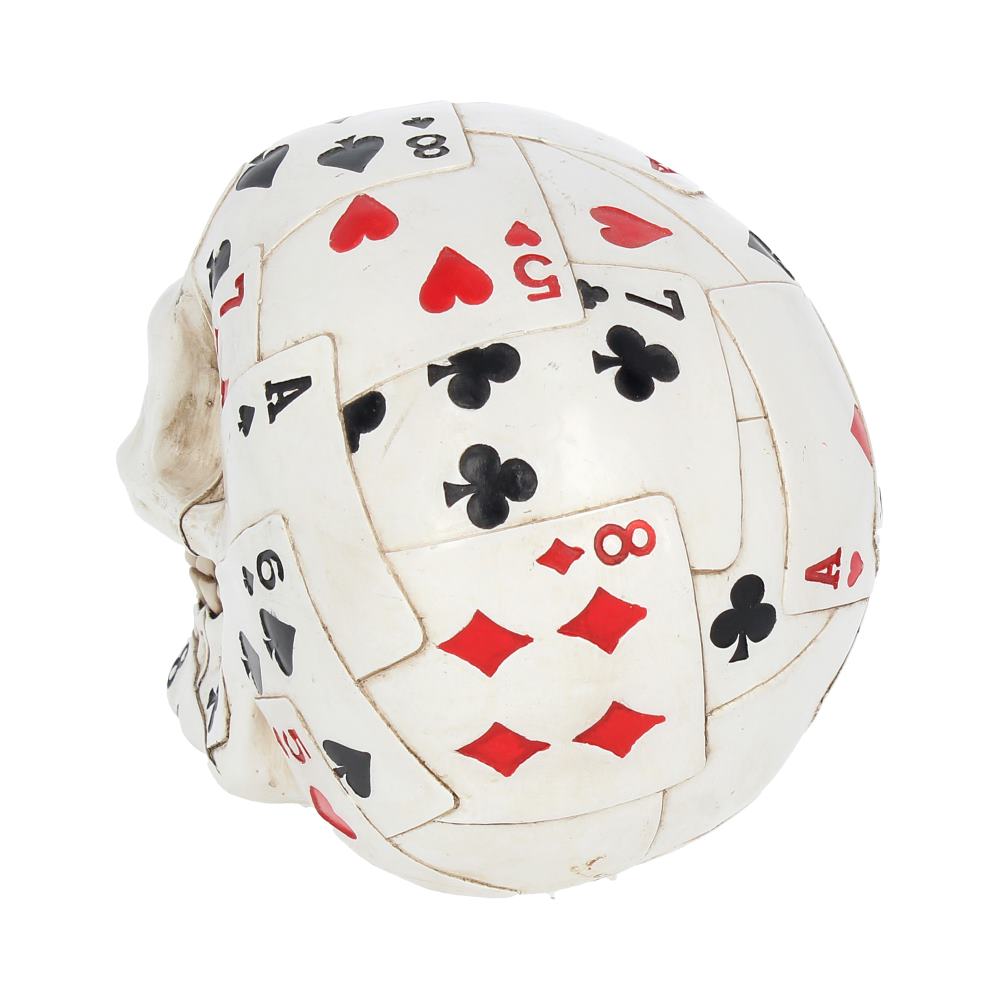 A skull covered in overlapping playing cards showcases card suits and numbers, including hearts, spades, diamonds, and clubs. It rests against a plain, white background.
