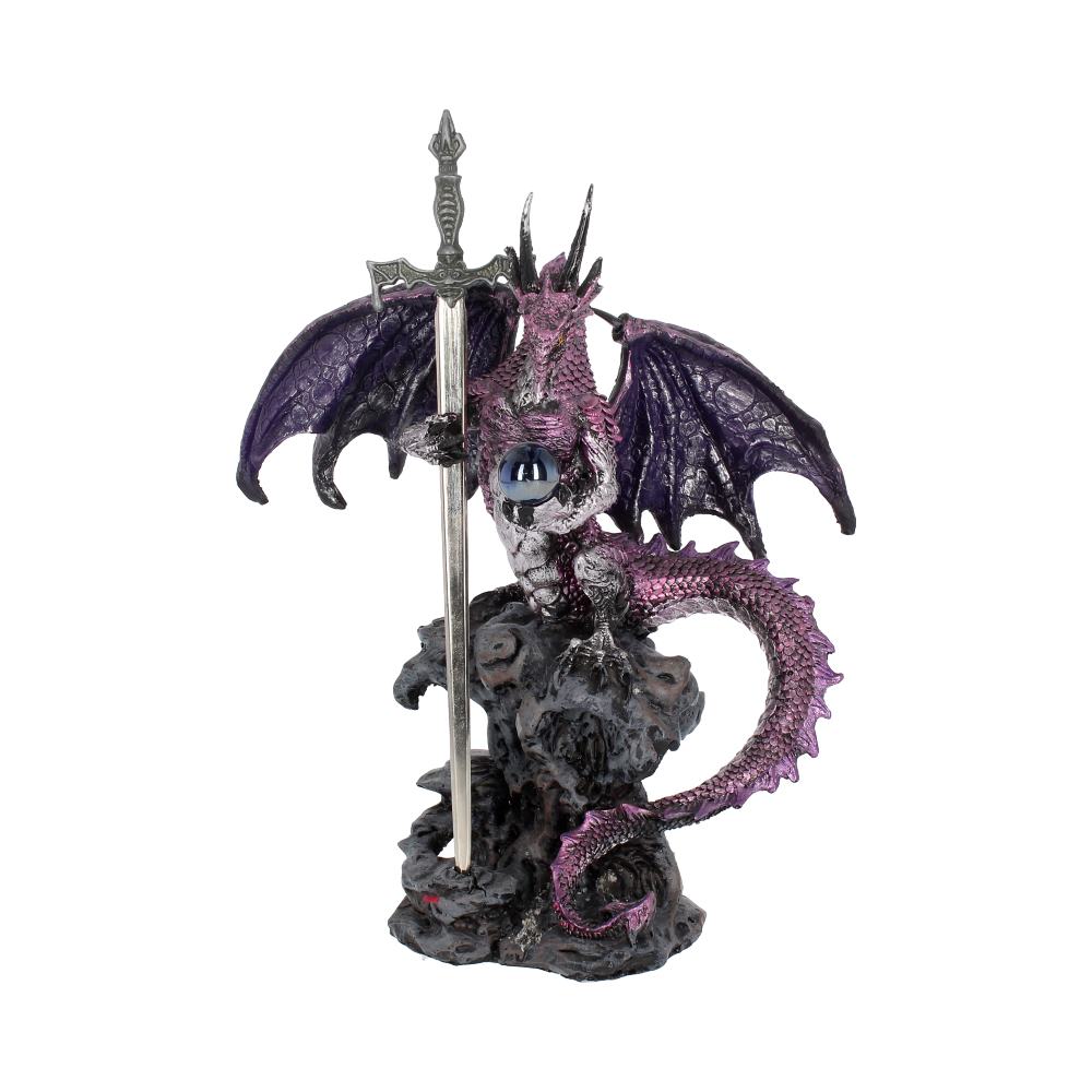 A purple dragon figurine holds a sword, clutching an orb; it perches atop a rocky base.