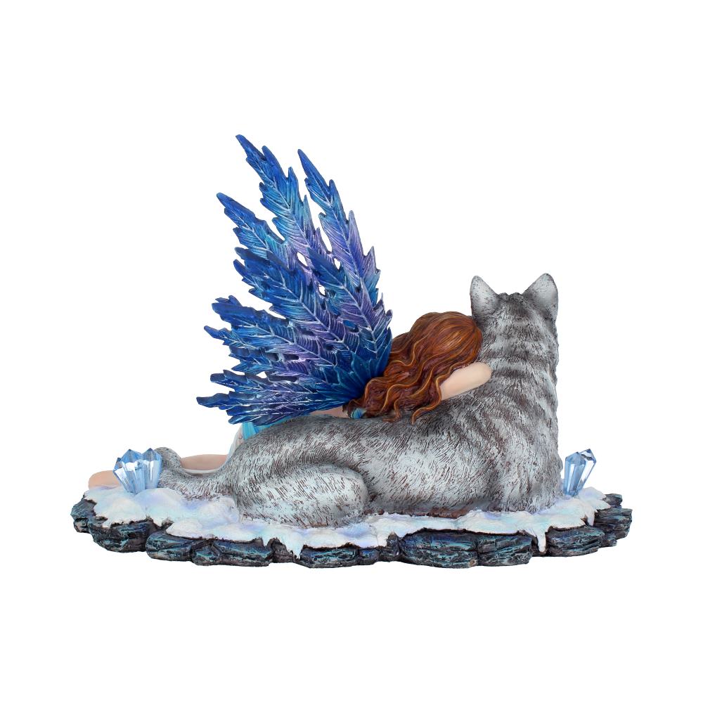 A detailed figurine of a person with blue, feathery wings embraces a large, gray wolf. They rest on a snow-covered, rocky surface, accentuated by small, crystalline structures.