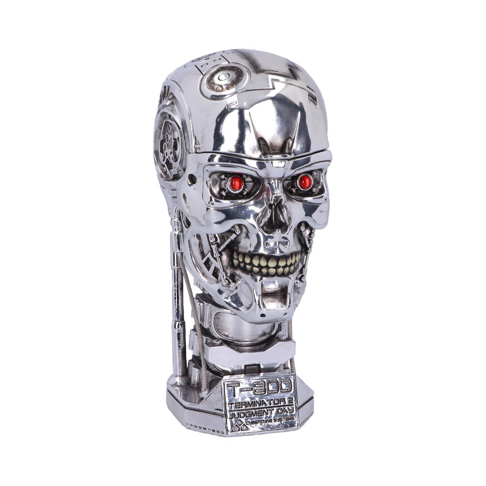A metallic robot head with red eyes and visible teeth stands upright. Text reads: "T-800 Terminator 2 Judgment Day Endo Arm Statue." The background is plain white.
