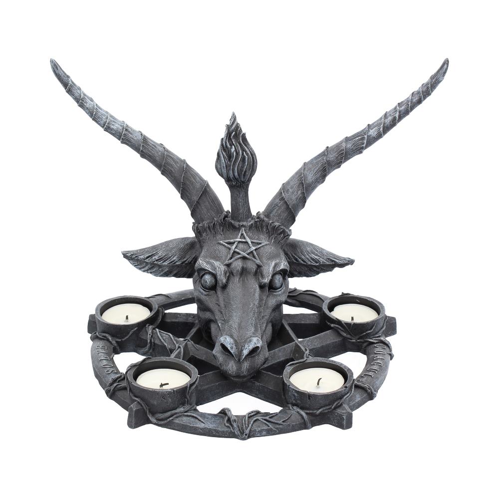 A gray Baphomet statue features five candles arranged around the base, each in a holder. The statue is isolated against a white background.