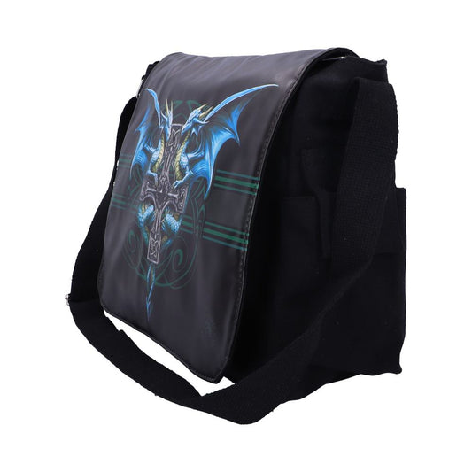 The black messenger bag displays a print of two blue dragons facing each other, framing a Celtic cross on the flap. The background has green lines and subtle details.