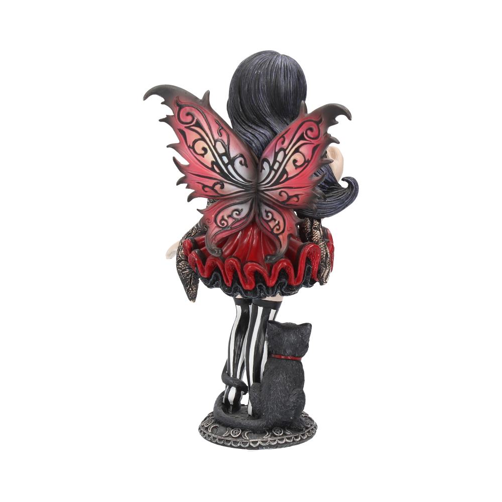 A fairy figurine with black hair and red and black wings stands with a black cat on a decorative base. The fairy wears a red skirt and striped stockings.