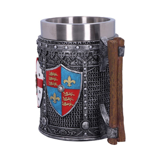 A metal-lined mug, styled as a medieval knight's armor, displays shields bearing lions and fleurs-de-lis. A wooden axe is attached to its side in front of a white background.