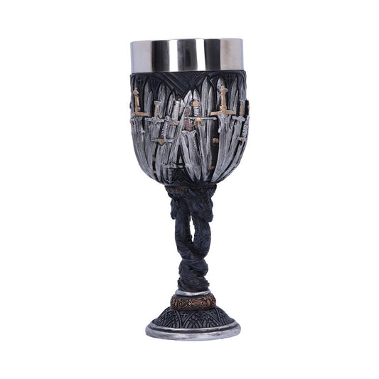An ornate, silver-colored goblet sits upright. A multitude of upright swords surround its cup. The stem is composed of entwined, sculpted dragons above a patterned base.