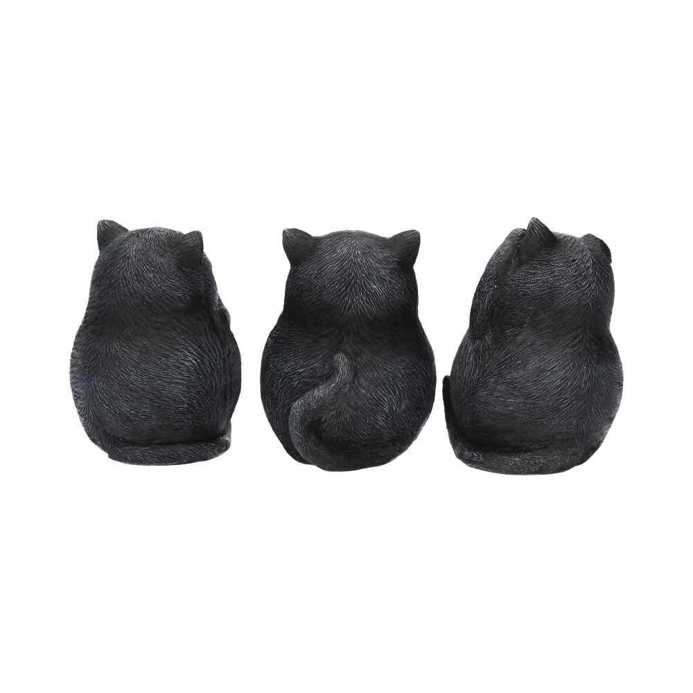 Three black cat figurines sit side by side, viewed from behind, with curled tails and textured fur. They are positioned against a plain white background.