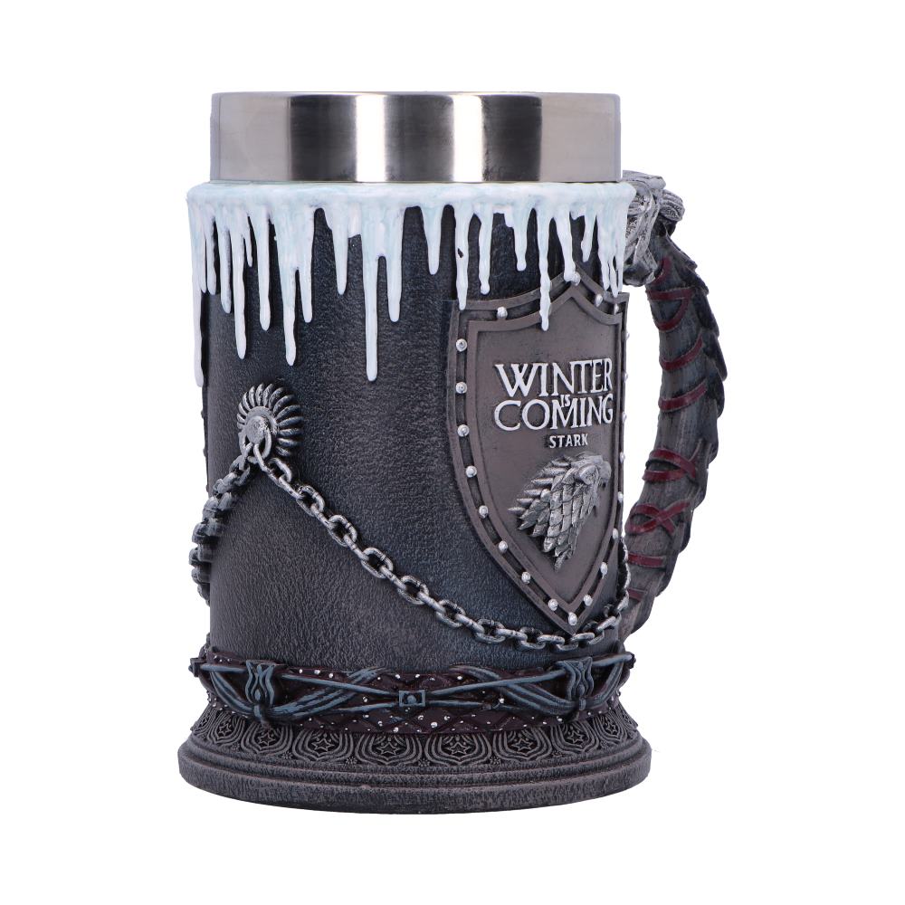 Decorative dark tankard bears text WINTER IS COMING STARK, topped with white icicle rim, chained wolf-emblem shield, braided handle and embossed base on a white background.