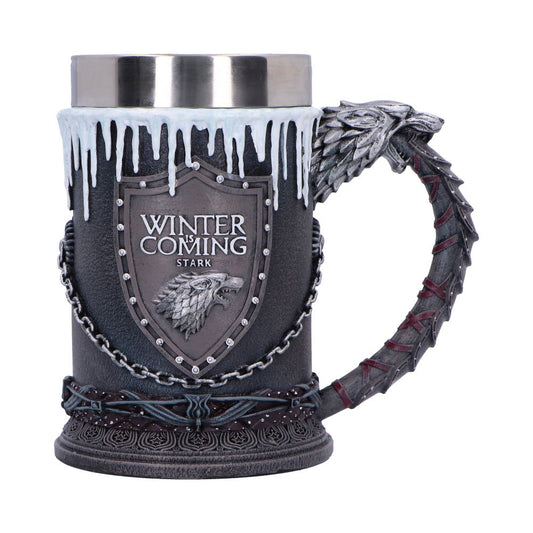 A decorative pewter topped tankard mug features a shield plaque reading "WINTER IS COMING STARK", a snarling direwolf relief, dripping icicle rim and sculpted wolf head scale handle against a white background.