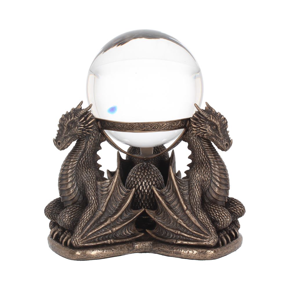 A crystal ball sits in a bronze holder formed by two dragons. The dragons hold up the orb with their backs while sitting on a base that reads "NEMESIS NOW".