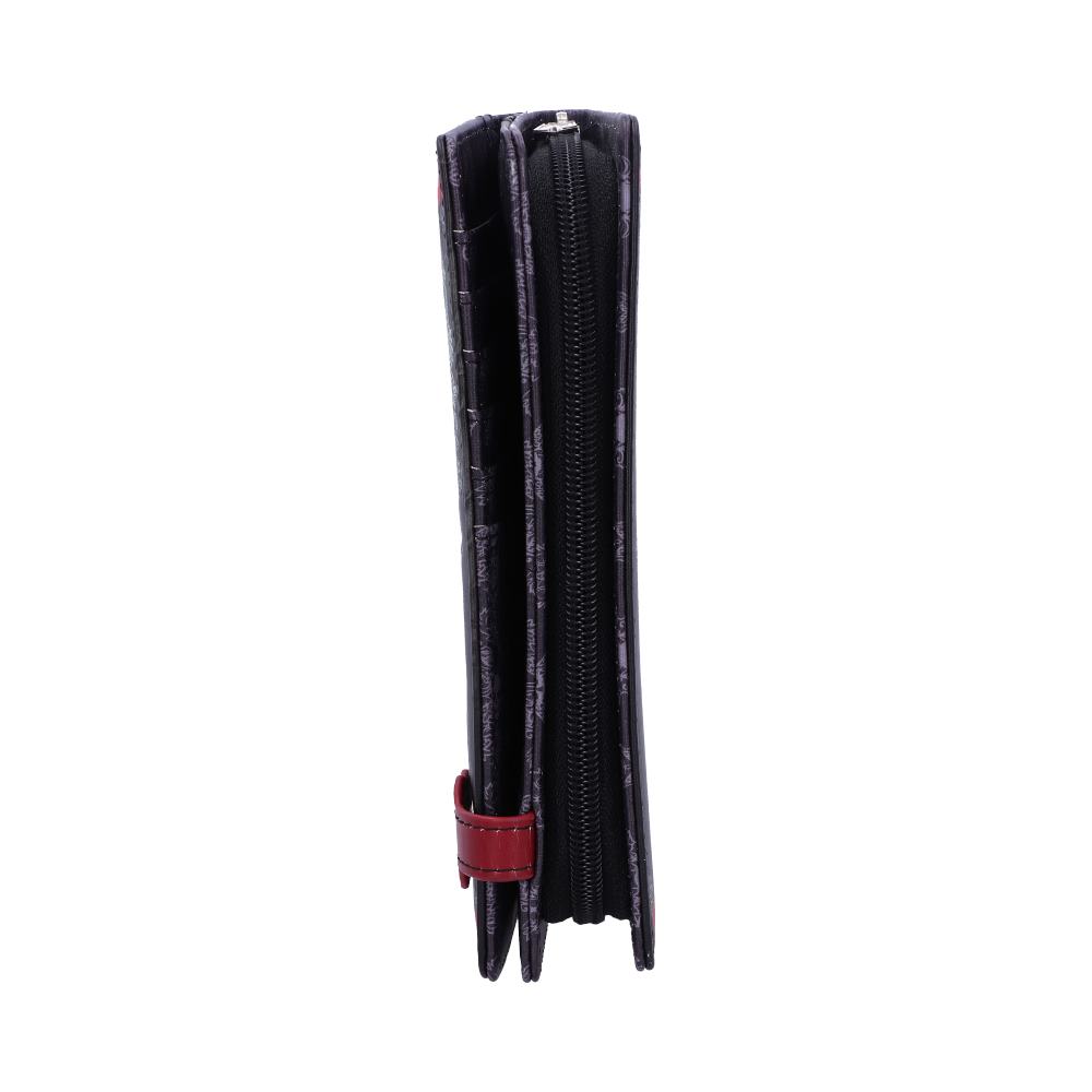 A black wallet stands upright, its zipper closed, against a white background. A small red strap is visible near the bottom.