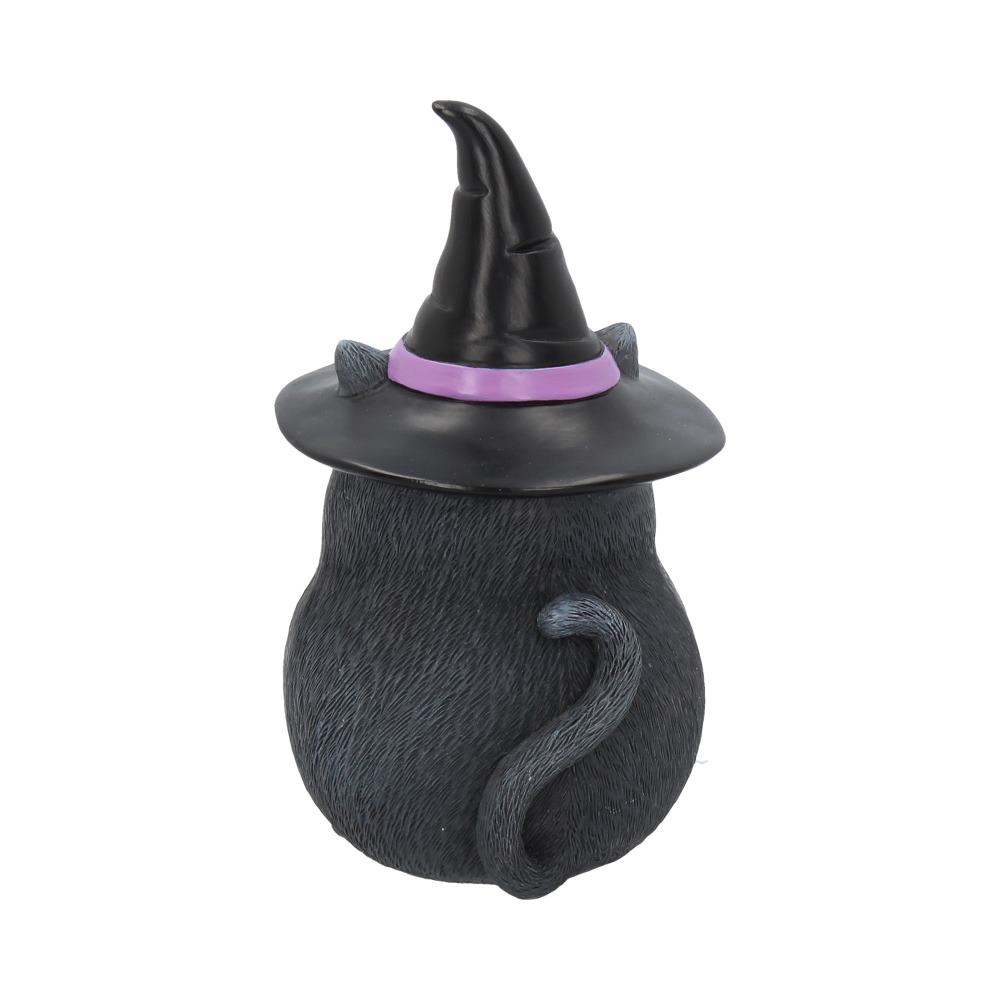 A black ceramic cat figurine, standing upright, wears a pointed witch hat with a purple band. The setting is a plain white background, emphasizing the whimsical design.