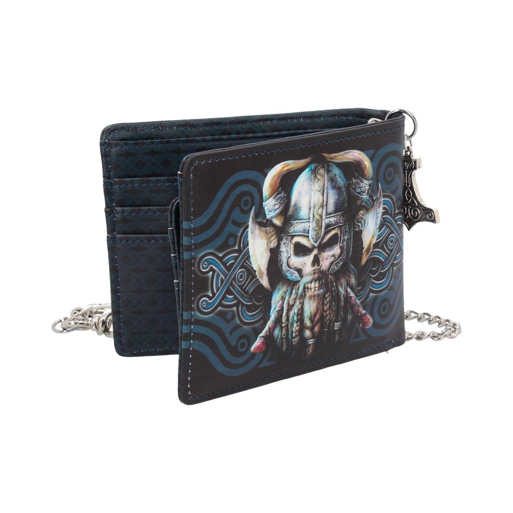 A bi-fold wallet, featuring a Viking skull design, rests open against a white background; it is attached to a metallic chain.