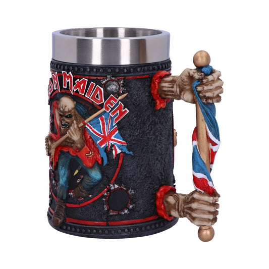 A decorative mug, featuring a skeletal figure holding a Union Jack flag, with detailed textures and bold colors. The text "Iron Maiden" appears prominently on it.