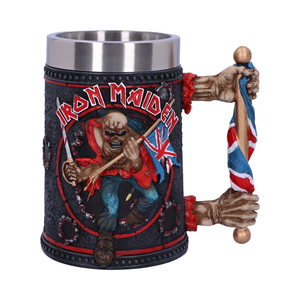 A decorative mug features a ghoulish figure holding a British flag, with text "IRON MAIDEN" above. The handle resembles skeletal hands gripping a staff.