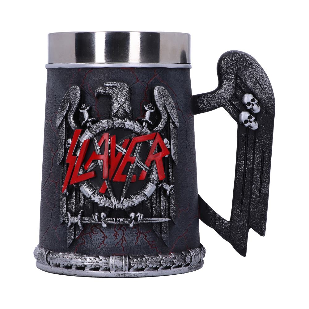 A black and silver tankard displays a detailed relief of an eagle, skulls, and swords, with red text "SLAYER" prominently featured. The handle resembles a wing adorned with skulls.