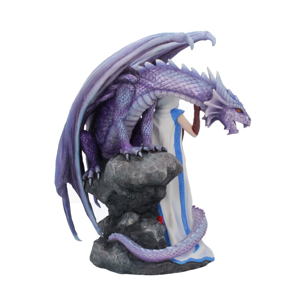 A purple dragon perches on a rocky platform, its wings spread. Beside it stands a robed figure, partially obscured, in a white and blue garment.