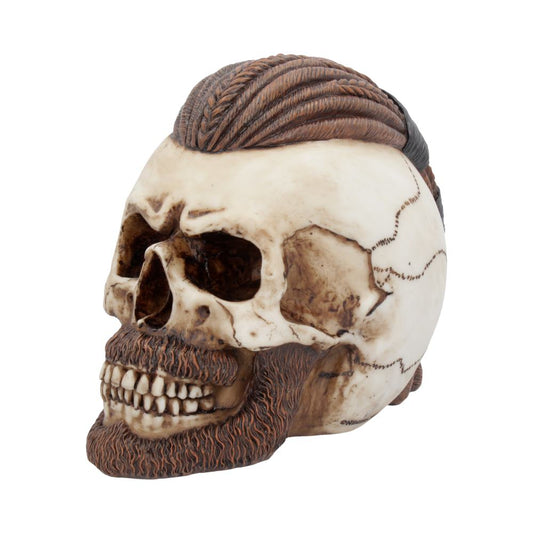 A skull with a sculpted, textured beard and stylized hair rests on a plain white background, showcasing detailed carved features and a polished finish.