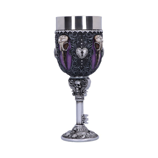 An ornate, gothic goblet stands on a key-shaped base. “Soul to Soul, the Caverns Yearning” is inscribed amidst raven skulls on a purple background.