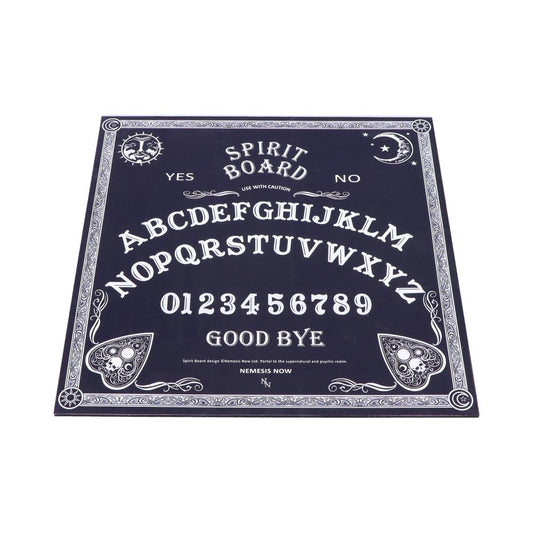 A rectangular spirit board with alphabet letters, numbers, and "YES," "NO," and "GOOD BYE" inscribed. Artistic skull designs and celestial symbols adorn the dark background. Text: "USE WITH CAUTION," "NEMESIS NOW."