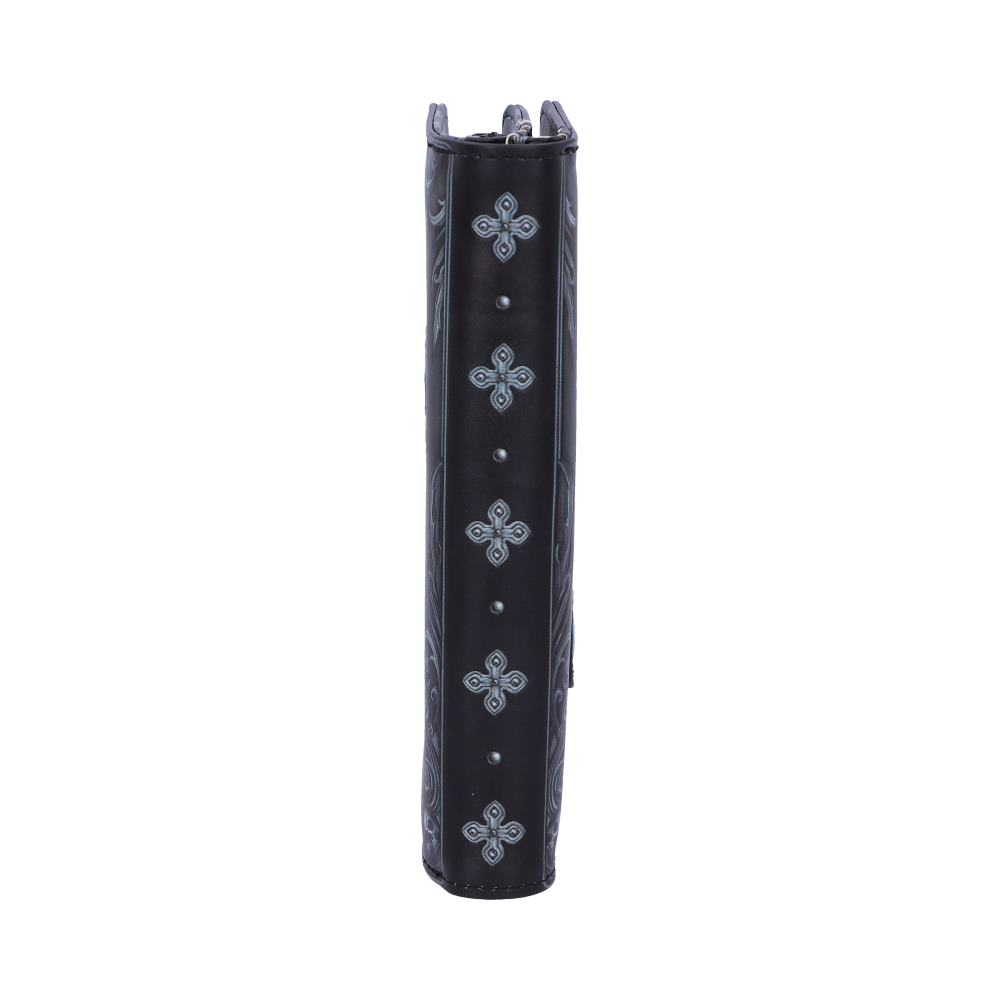 Black cylindrical object stands vertically, adorned with decorative silver floral patterns and small silver studs, against a plain white background.