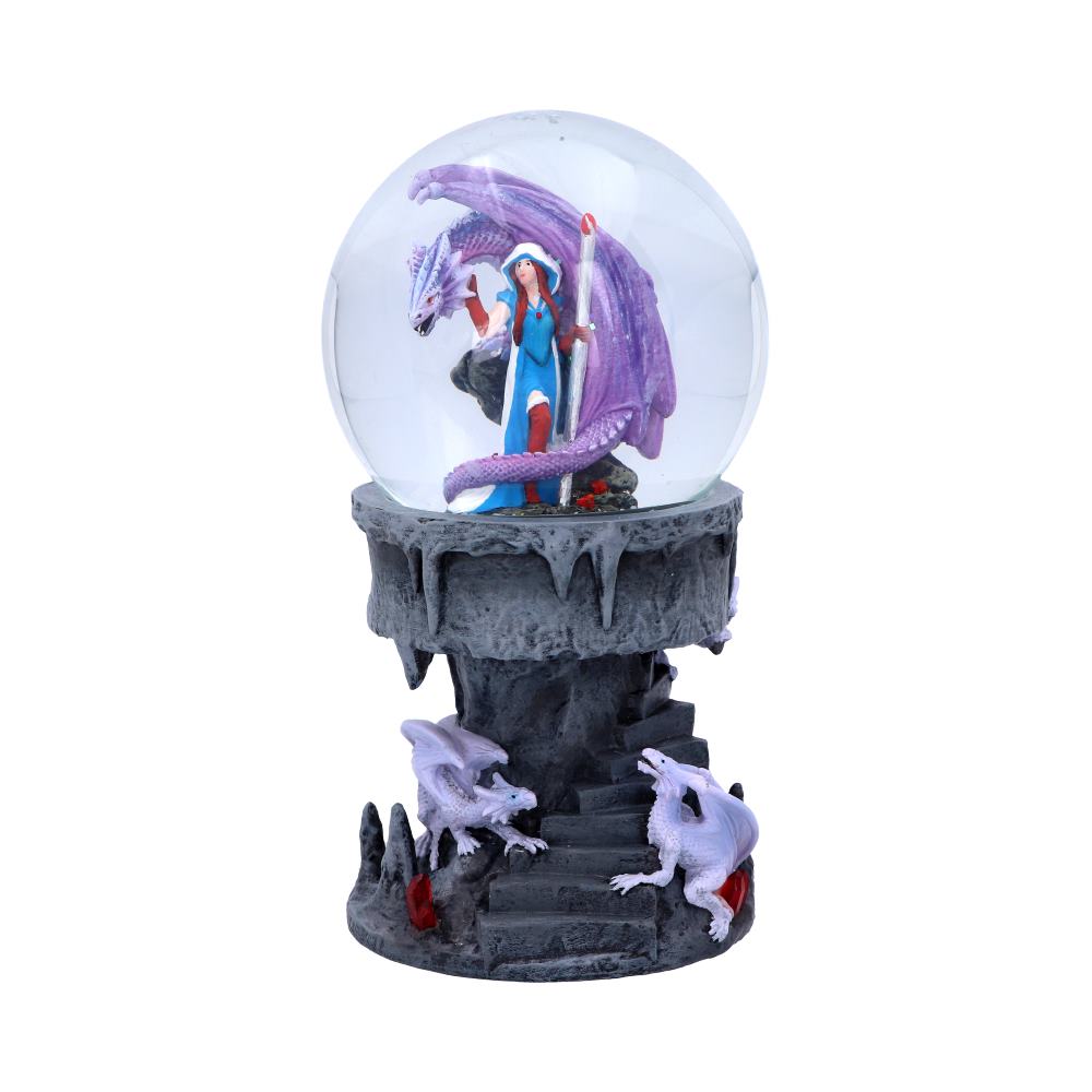 A snow globe featuring a woman and a purple dragon sits atop a grey, stone-like base, with two smaller white dragons at its feet.