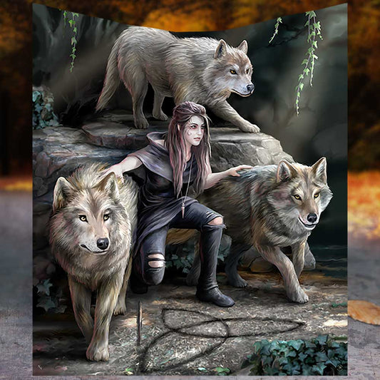 A person crouches beside three wolves on rocky terrain, surrounded by ivy. They rest an arm on each wolf, creating a protective stance in a forest setting.
