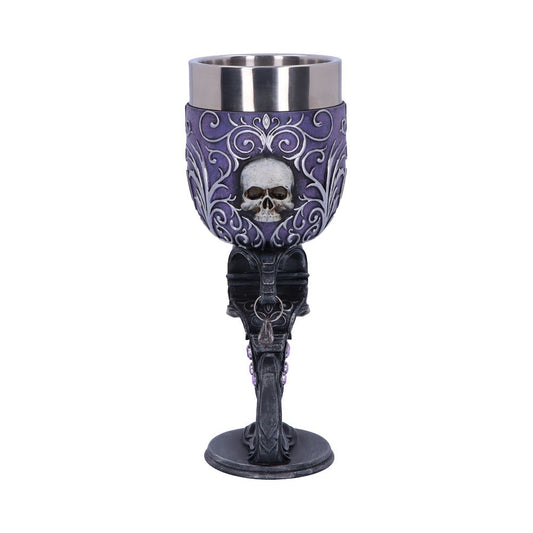 A decorative goblet features a metallic rim, a detailed skull design on a purple background, and an ornate black stem; it is isolated against a plain white background.