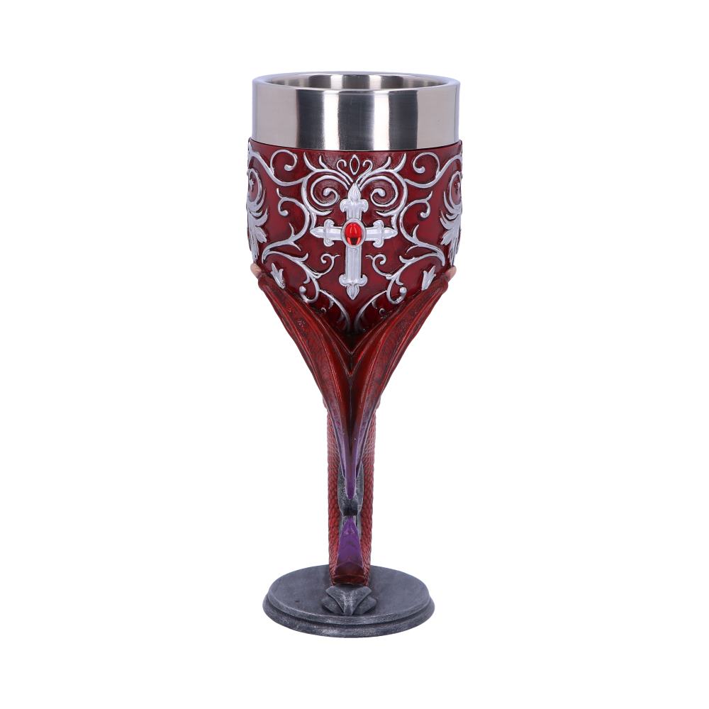 An ornate red goblet with silver filigree and a bejeweled cross stands. The stem is sculpted to resemble dragon claws, and rests on a pewter-colored base against a white background.