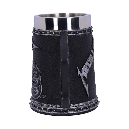 A black stein displaying raised metallic decorations and the word "Metallica," is surrounded by rope-like trim, in a plain, white background.