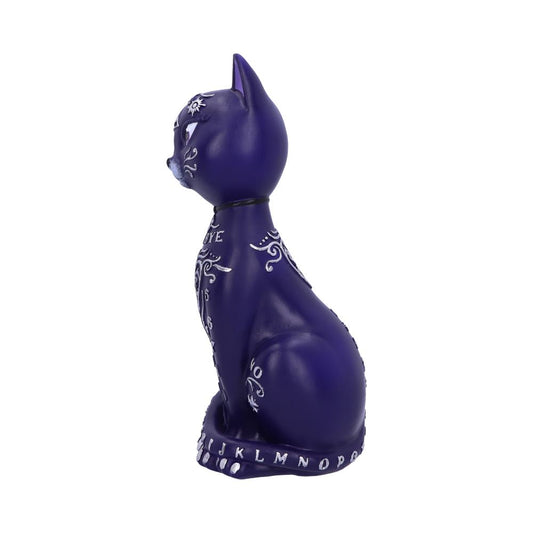 A dark purple cat figurine displays intricate white designs and text. The left side reads "EYE," "YES," "NO," and letters "A" to "Z" encircle the base. The background is plain white.