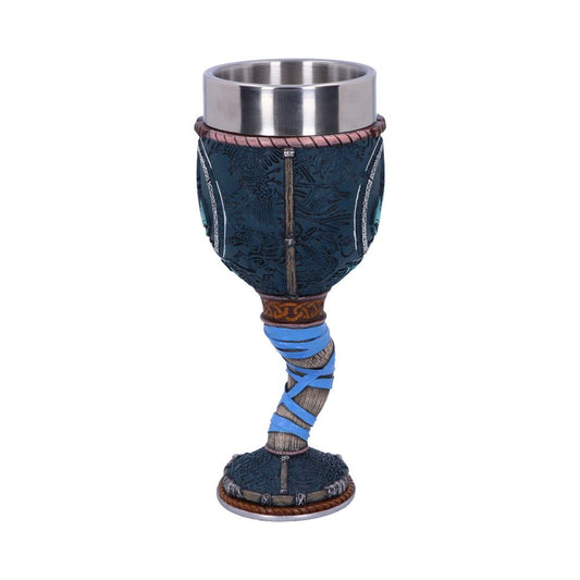 A decorative goblet with a metal cup top, intricately designed with blue, black, and silver patterns, sits on a twisted stem wrapped in blue rope, placed against a plain white background.