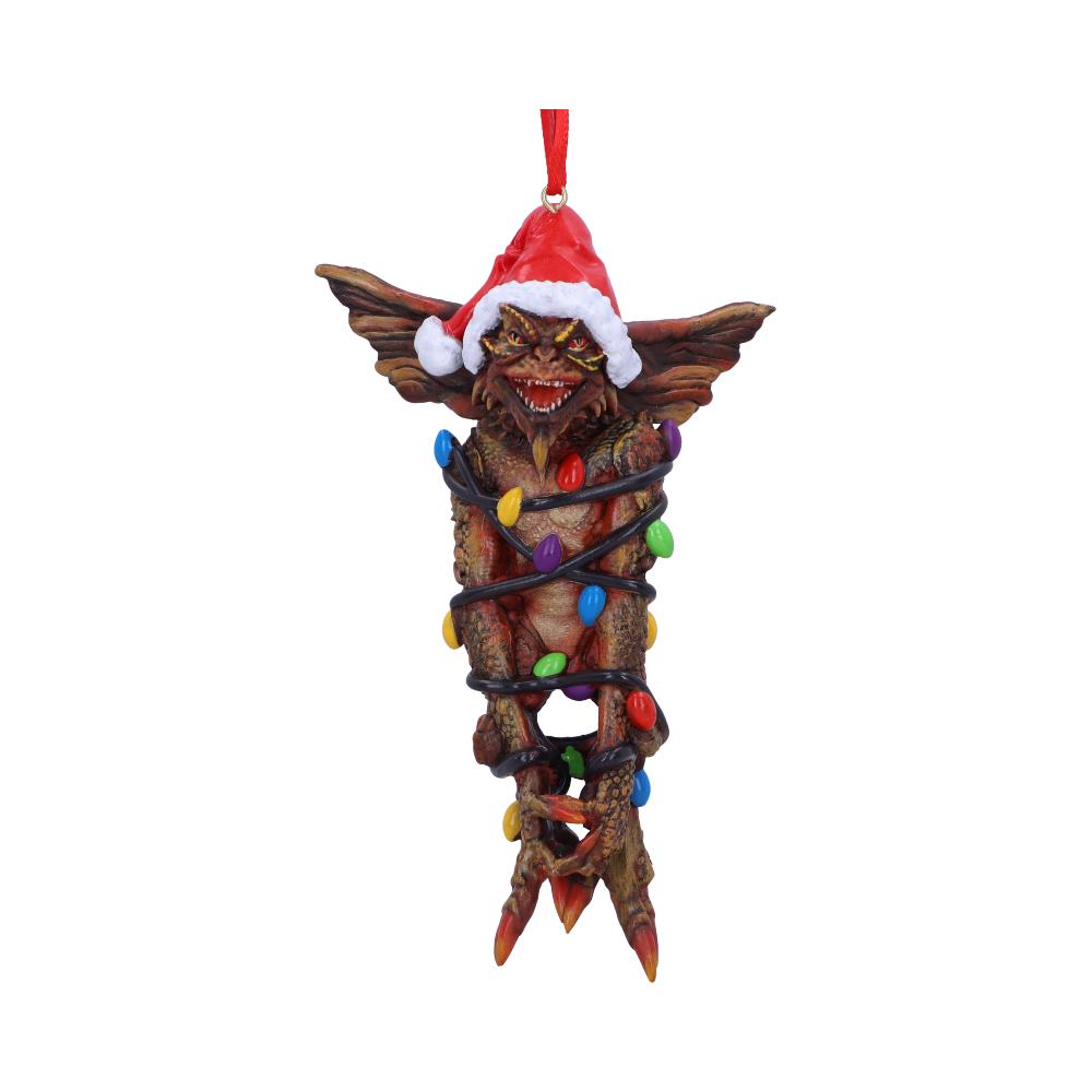 A small creature with large ears, wearing a Santa hat, is wrapped in colorful Christmas lights, suspended by a red string against a plain white background.