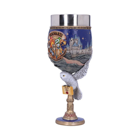 The goblet features the Hogwarts crest with "Hogwarts" text, depicting a castle scene. An owl holding a letter supports the base, blending fantasy elements in a decorative context.