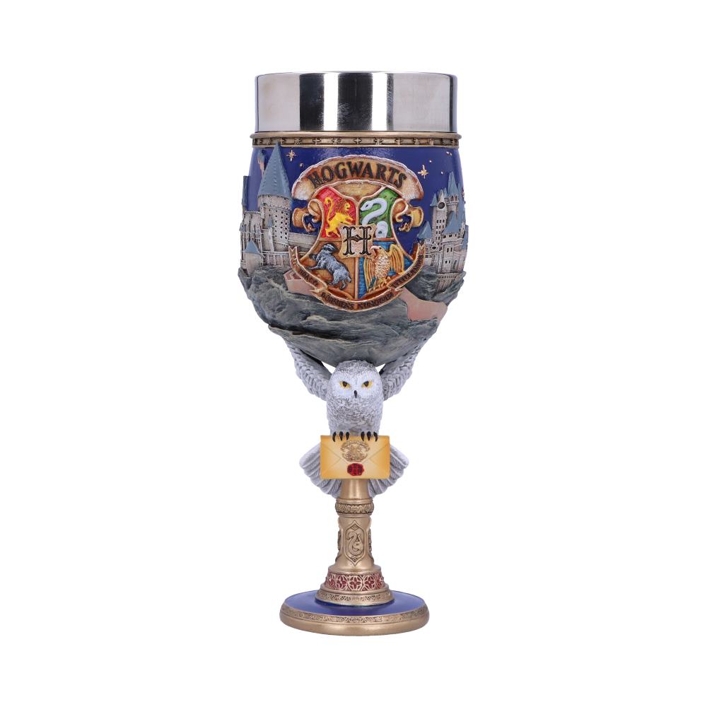 A decorative goblet featuring the "Hogwarts" crest, surrounded by castle imagery. An owl figurine holds a letter at the base, set against a regal background.