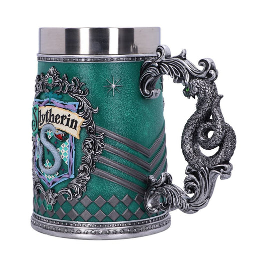 A decorative stein features the "Slytherin" crest with a green and silver design, ornate silver dragon handle, and star embellishments, evoking a magical and regal atmosphere.