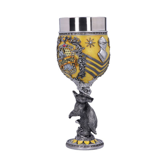 A decorative goblet features a metallic badger base, supporting a yellow cup adorned with a crest, reading "Hufflepuff." Intricate armor, stars, and stripe designs embellish the surface.