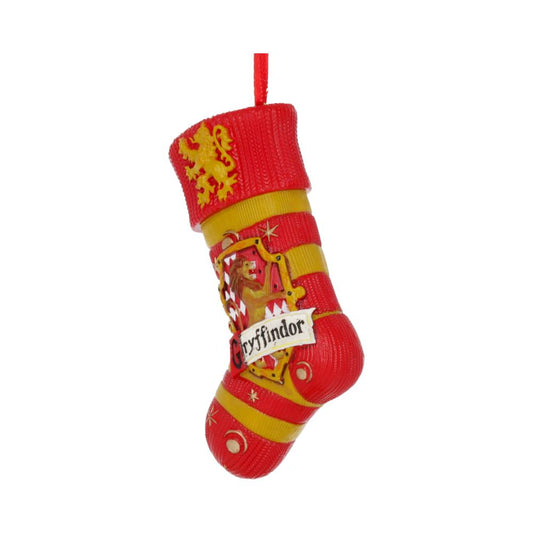 A red and gold striped stocking ornament featuring a lion and the word "Gryffindor" hangs from a red loop, symbolizing its association with a fictional house.