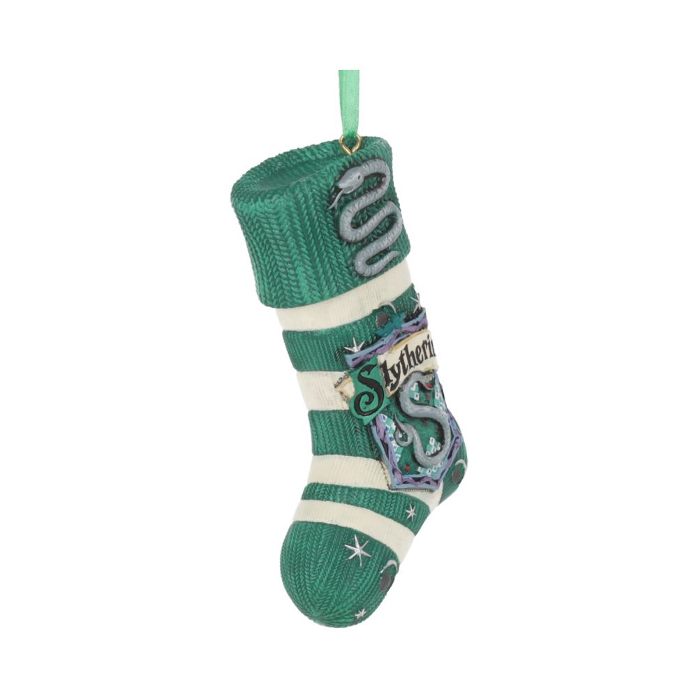 A green and white striped stocking, featuring "Slytherin" text and a snake emblem, is hanging by a green loop in a plain white background.