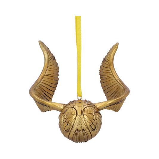 A golden winged object hangs from a yellow ribbon. The intricately designed round body features engraved patterns, resembling an ornate, decorative ornament. It is isolated against a plain white background.