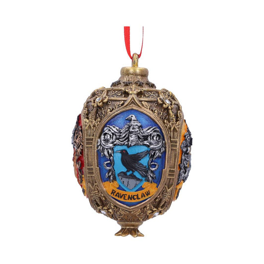An ornate gold ornament featuring the Ravenclaw crest, displaying a black raven on blue background, hangs from a red ribbon. Text reads "Ravenclaw." Intricate patterns adorn the surface.