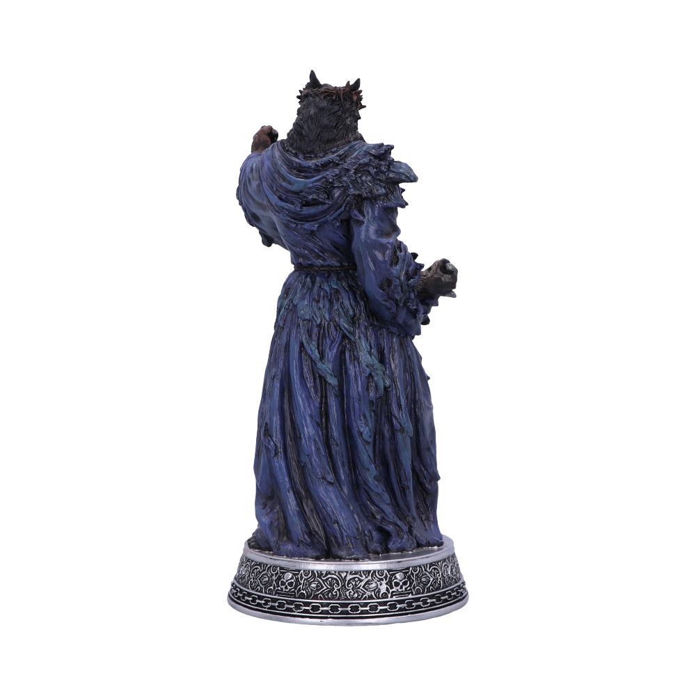 A statue of a robed, wolf-headed figure stands with its back to the viewer. It's set on a decorative base with intricate patterns, against a plain white background.